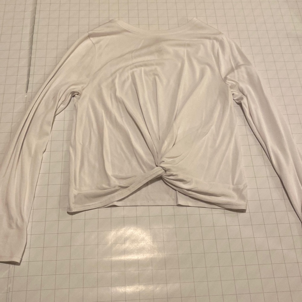 White, athletic long sleeve with crossed over fabric in front